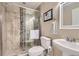 Well-lit bathroom with a glass shower, modern fixtures, and stylish tile accents at 14110 Greenfield Loop, Parker, CO 80134
