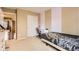 Well-lit bedroom with white sliding closet doors and a desk area at 14110 Greenfield Loop, Parker, CO 80134