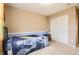 A serene bedroom with neutral walls and carpet, featuring a closet and a large window at 14110 Greenfield Loop, Parker, CO 80134