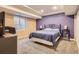Comfortable bedroom with a large bed, neutral carpet, and natural light from the window at 14110 Greenfield Loop, Parker, CO 80134