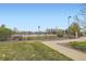 Inviting community pool area with a fenced pool, shaded seating, and well-maintained landscaping at 14110 Greenfield Loop, Parker, CO 80134