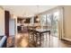 Spacious kitchen area with eat in dining connected to stainless appliances and hardwood floors at 14110 Greenfield Loop, Parker, CO 80134