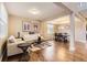 Inviting living room open to the dining room features hardwood floors, neutral paint and ample natural light at 14110 Greenfield Loop, Parker, CO 80134