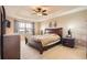 Large primary bedroom suite with trey ceiling, ample natural light, and elegant furnishings at 14110 Greenfield Loop, Parker, CO 80134