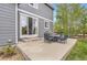 Back patio with outdoor dining set and grill, perfect for entertaining in the backyard at 14110 Greenfield Loop, Parker, CO 80134