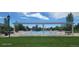 Community swimming pool with shaded seating area, providing a comfortable space for residents at 14110 Greenfield Loop, Parker, CO 80134