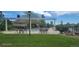Community pool area with shaded seating and landscaped grounds for a resort-like experience at 14110 Greenfield Loop, Parker, CO 80134