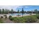 Community swimming pool with lounge chairs and tables, perfect for relaxing and enjoying the outdoors at 14110 Greenfield Loop, Parker, CO 80134