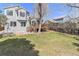 Spacious backyard features a wooden deck and lush green lawn, perfect for outdoor entertaining at 1838 Wilson Cir, Erie, CO 80516