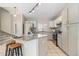 Lovely kitchen area featuring an island with bar seating, granite countertops, and stainless steel appliances at 1838 Wilson Cir, Erie, CO 80516