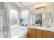 Bright, spacious main bathroom with double sinks and large soaking tub at 1838 Wilson Cir, Erie, CO 80516