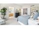 Comfortable main bedroom with a view of the ensuite bathroom and walk-in closet at 1838 Wilson Cir, Erie, CO 80516