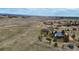 Expansive aerial view showcases the property's serene country setting and rolling landscape at 2130 Frontier Ln, Franktown, CO 80116
