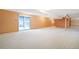 Large finished basement with sliding door to the outside, ready for entertaining and relaxing at 2130 Frontier Ln, Franktown, CO 80116
