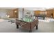 Finished basement with pool table, foosball table and lounge area at 2130 Frontier Ln, Franktown, CO 80116