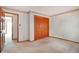 Bright bedroom featuring a large closet, neutral carpet, and decorative trim at 2130 Frontier Ln, Franktown, CO 80116