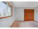 Light-filled bedroom with a view from a large window and sizable closet at 2130 Frontier Ln, Franktown, CO 80116
