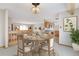 Dining room with elegant chandelier and nearby open kitchen at 2130 Frontier Ln, Franktown, CO 80116
