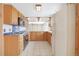 Kitchen featuring wood cabinetry, tile floor, and matching appliances at 2130 Frontier Ln, Franktown, CO 80116