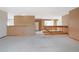 Open-concept floor plan with wooden railing overlooking dining and kitchen areas at 2130 Frontier Ln, Franktown, CO 80116