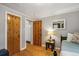 Bedroom featuring wood floors, natural light and two wood doors at 4364 Colorado 103, Idaho Springs, CO 80452