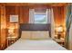 Relaxing bedroom with wood paneling and large windows providing scenic views at 4364 Colorado 103, Idaho Springs, CO 80452