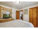 Cozy bedroom with wood accents, TV and large mirror at 4364 Colorado 103, Idaho Springs, CO 80452