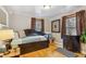 Charming bedroom with hardwood floors, daybed, neutral walls and natural light at 4364 Colorado 103, Idaho Springs, CO 80452