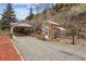 Charming home exterior features a greenhouse and carport at 4364 Colorado 103, Idaho Springs, CO 80452
