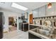 Modern kitchen with a double sink and a view of the living room with a fireplace at 4364 Colorado 103, Idaho Springs, CO 80452