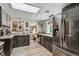 Charming kitchen featuring sleek black cabinets, modern appliances, and bright, airy lighting at 4364 Colorado 103, Idaho Springs, CO 80452