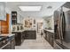 Bright kitchen with granite countertops, wooden floors, and stainless steel refrigerator at 4364 Colorado 103, Idaho Springs, CO 80452