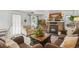 Comfortable living room with a fireplace and stone accent wall, neutral furniture and lots of natural light at 4364 Colorado 103, Idaho Springs, CO 80452