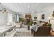 Open-concept living room featuring wood-paneled ceiling, a stone fireplace, and a spacious layout at 4364 Colorado 103, Idaho Springs, CO 80452