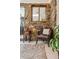 Inviting living room nook with stone wall, leather chair, and side table next to a view of the kitchen at 4364 Colorado 103, Idaho Springs, CO 80452
