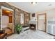 Charming living room features stone accent wall, fireplace and comfortable seating, with rustic decor at 4364 Colorado 103, Idaho Springs, CO 80452