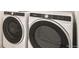 Modern laundry area with high-efficiency washer and dryer at 6874 Zuni Ct, Denver, CO 80221