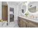 Bathroom featuring double vanity, marble tile floor, and luxurious fixtures providing a clean, and spa-like atmosphere at 1060 S Parker Rd # 36, Denver, CO 80231