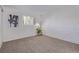 Bedroom featuring a brick accent wall, carpeted floors, and natural light from the window offer a cozy and modern space at 1060 S Parker Rd # 36, Denver, CO 80231