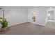 Bedroom with white brick wall and open bathroom featuring a double vanity, providing a functional and stylish space at 1060 S Parker Rd # 36, Denver, CO 80231