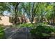 Serene townhome community grounds featuring lush greenery, mature trees and inviting outdoor spaces at 1060 S Parker Rd # 36, Denver, CO 80231