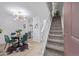 Open layout boasts a dining area, stairs to second level, and access to kitchen space at 1060 S Parker Rd # 36, Denver, CO 80231