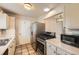 Functional kitchen with stainless steel appliances, gas range, and tiled flooring at 21470 E Aberdeen Dr, Centennial, CO 80015