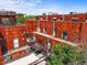 Aerial view showcasing the building's modern architecture and rooftop features at 2565 Champa St, Denver, CO 80205