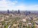 Panoramic aerial view of the city skyline showcasing downtown buildings and the surrounding urban landscape at 2565 Champa St, Denver, CO 80205