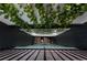 Vertical view of an atrium with hanging plants and a skylight offering natural light at 2565 Champa St, Denver, CO 80205