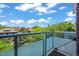 City view from a spacious balcony with glass railings and wood decking at 2565 Champa St, Denver, CO 80205