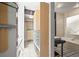 Combined bathroom and closet space featuring sleek fixtures and ample storage at 2565 Champa St, Denver, CO 80205