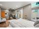 Well-lit bedroom with sliding glass doors leading to a patio and stylishly minimal decor at 2565 Champa St, Denver, CO 80205