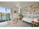 Cozy bedroom with unique wallpaper, bright windows, and outdoor access at 2565 Champa St, Denver, CO 80205